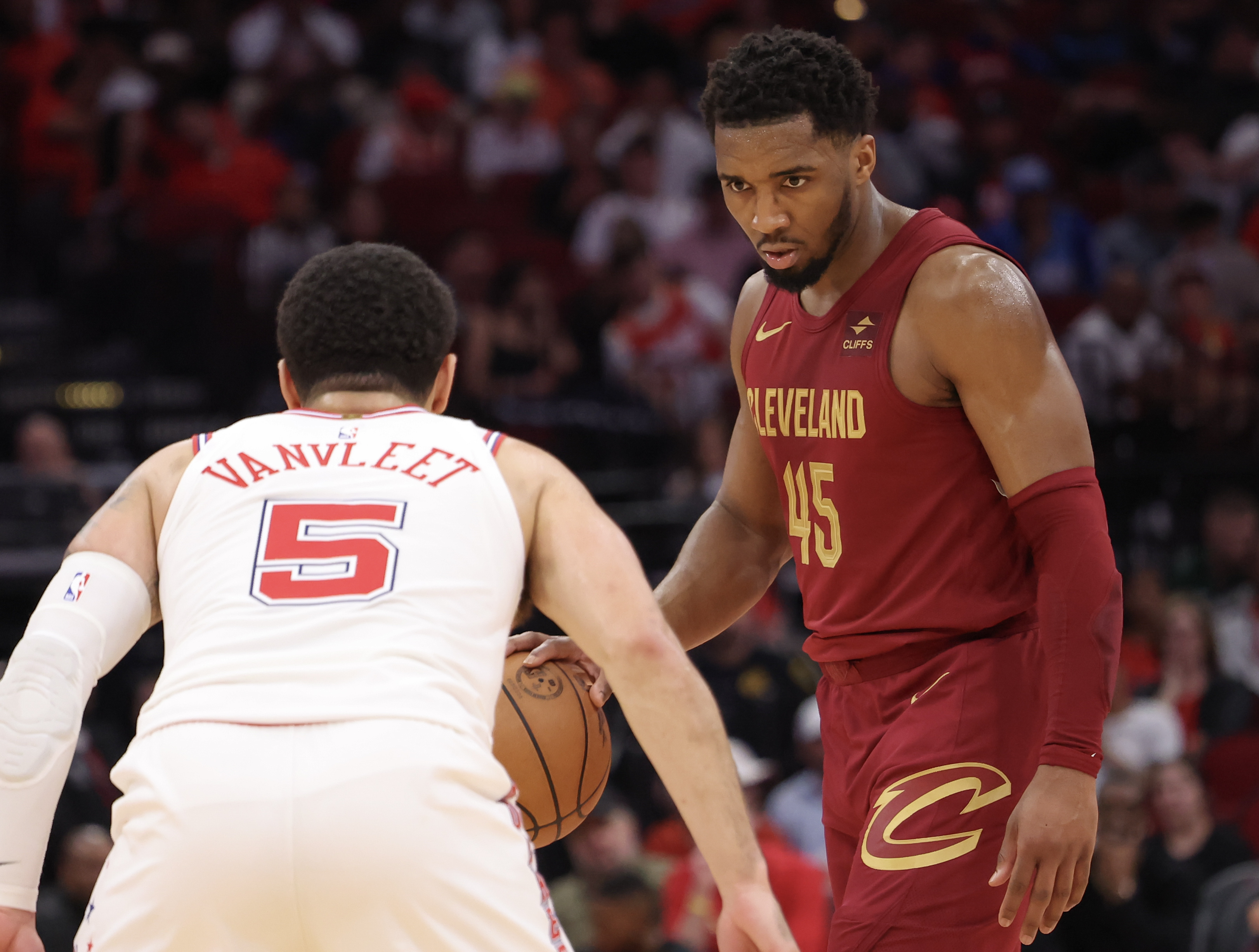 Mar 16, 2024; Houston, Texas, USA; Cleveland Cavaliers guard Donovan Mitchell (45) dribbles against Houston Rockets guard Fred VanVleet (5) in the second half at Toyota Center.
